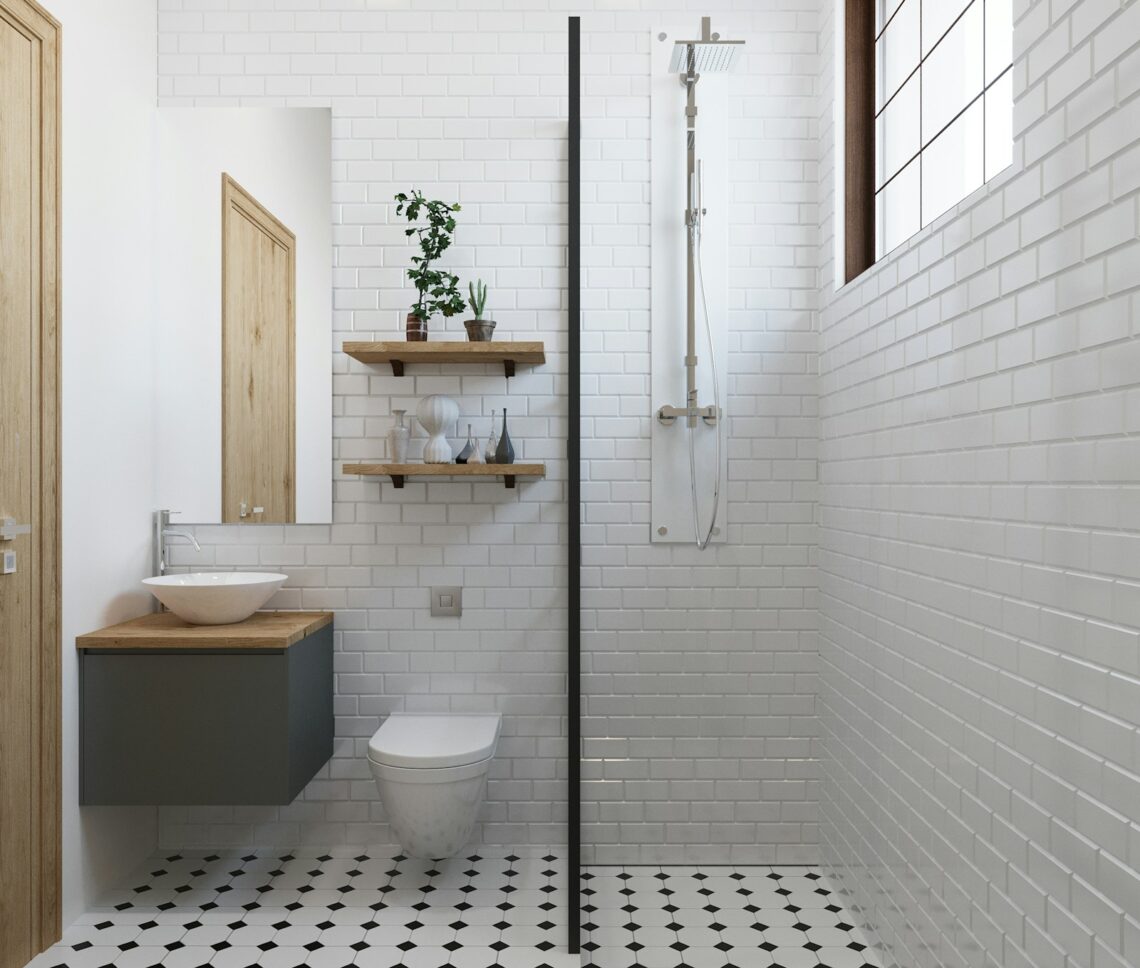 small apartment bathroom under $100 makeover with subway tile floating shelves and plants