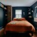 Small NYC apartment bedroom with window AC unit and renter friendly decor