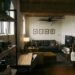 small loft apartment for two with sofa, desk and gallery wall