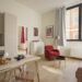 small apartment decor for young professionals with red chair sofa and modern kitchen