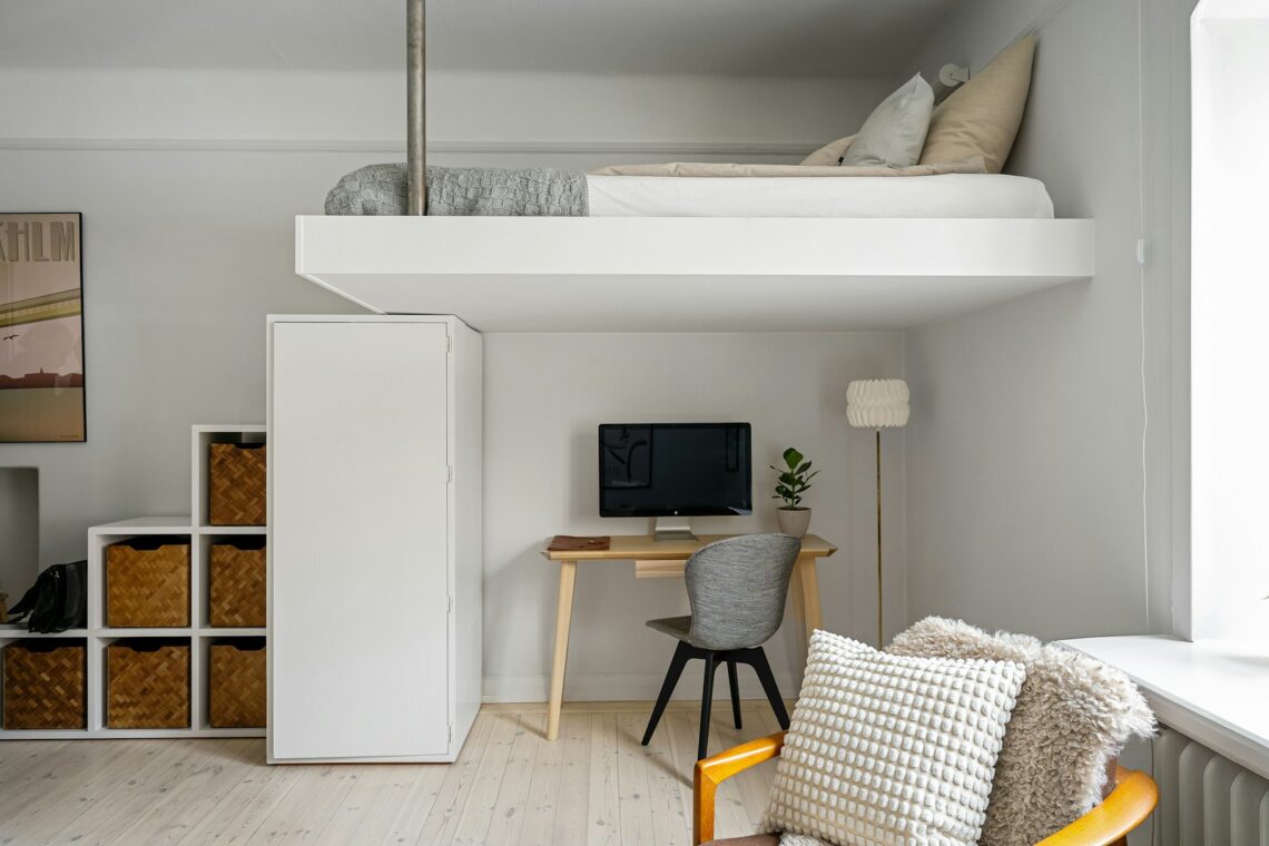400 sq ft studio apartment with loft bed desk and storage cubbies