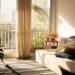 Cozy fall apartment living room with warm golden light and indoor plants