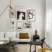 modern small apartment living room with a gold brass arc floor lamp sweeping over a white sofa