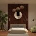 Japandi bedroom with low platform bed, wood slat accent wall, woven pendant lights, and monstera plant