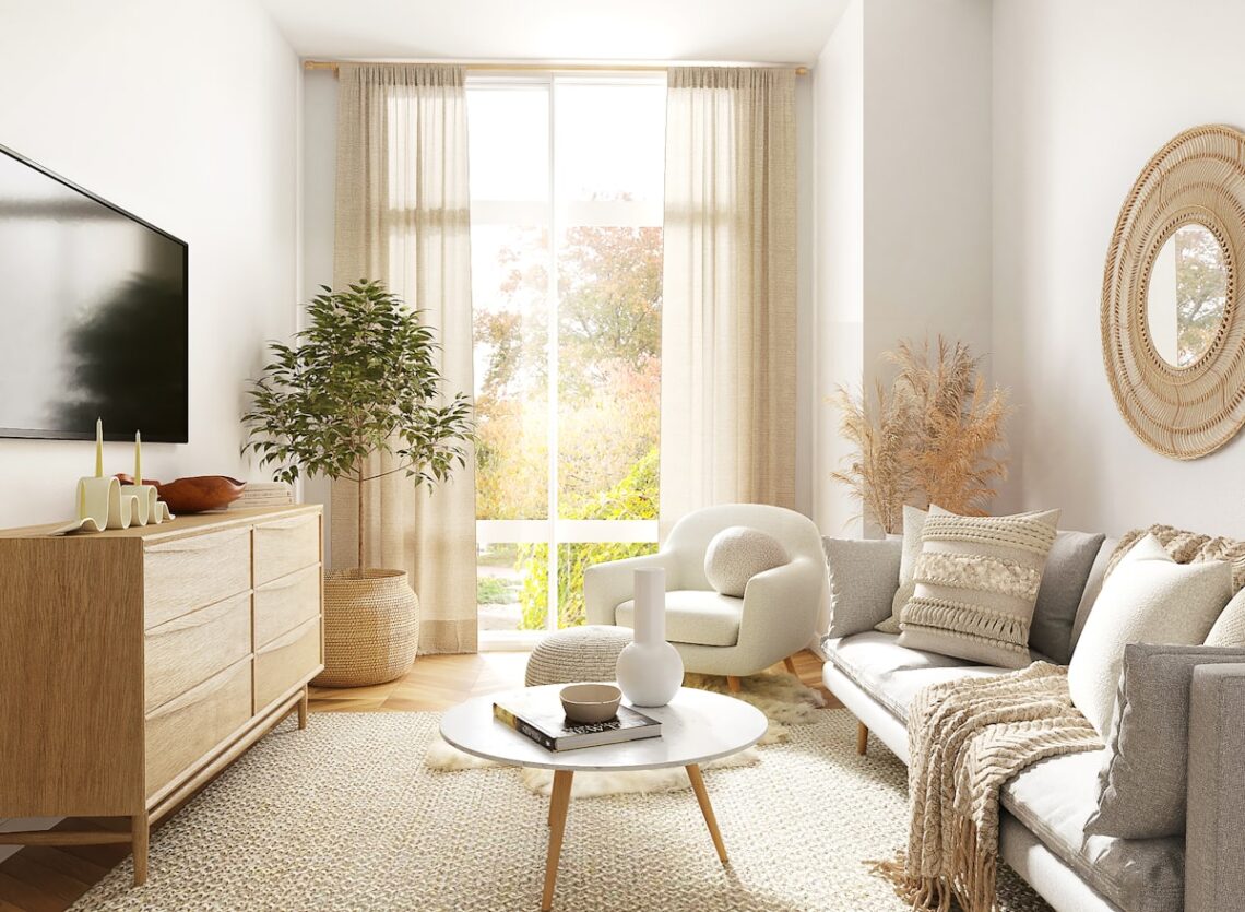 Warm Scandinavian living room with natural wood dresser, white round coffee table, indoor plant, and sheer linen curtains