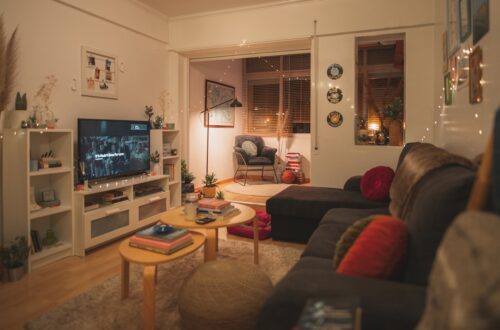 cozy small apartment living room with fairy lights and warm amber glow