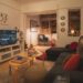 cozy small apartment living room with fairy lights and warm amber glow