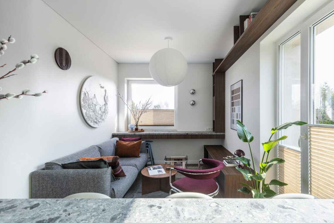 modern small apartment living room with wall-mounted bookshelves and cozy decor