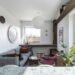 modern small apartment living room with wall-mounted bookshelves and cozy decor